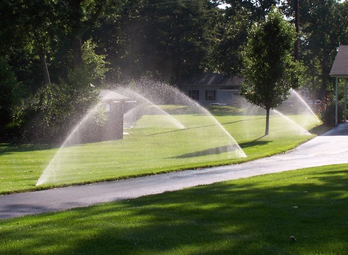Sprinklers in a Beautiful Lawn.